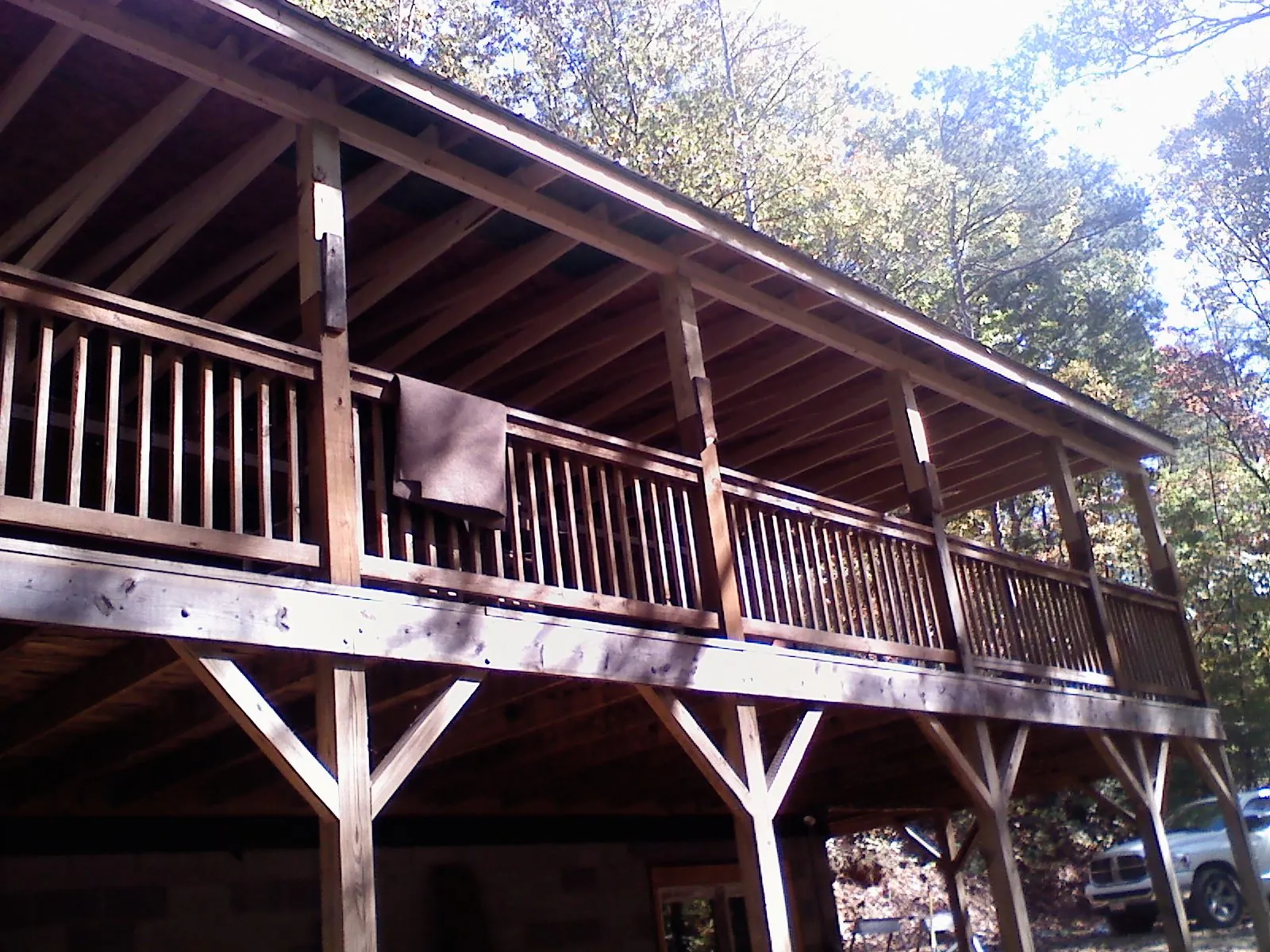 Timber framing under a new elevated porch and deck — Roof Leak Repair in Milford Center by Roofing Brothers